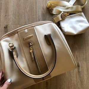 Samsonite cream colored travel bag